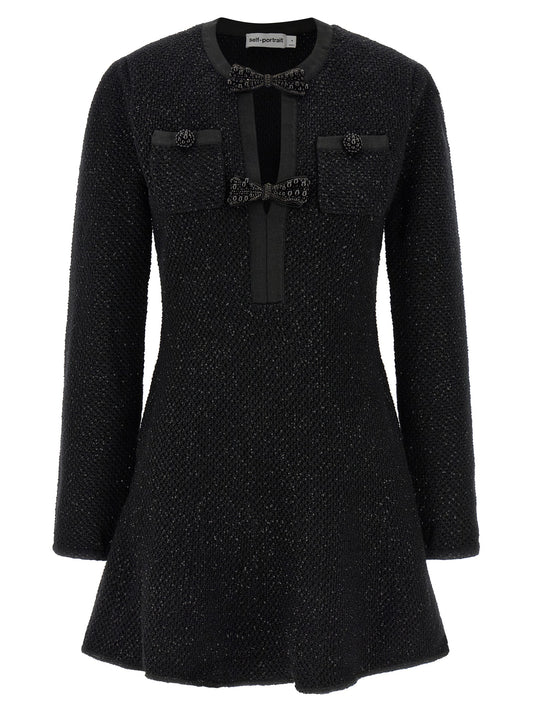 Dress by Self-Portrait for women in cotton polyester wool & sequins black showcases a striking silhouette, elegantly detailed with a , refined crew neckline, and a striking short mini for a striking finish.