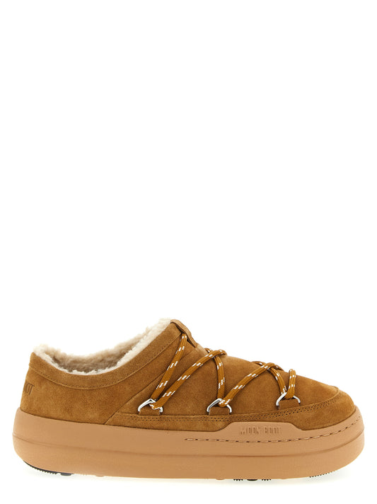 Mules Slippers Flat Shoes by Moon Boot for women in suede leather fur & polyamide brown showcases a dynamic silhouette, artfully capturing Women's Suede Leather Fur & Polyamide Mules Slippers Flat Shoes through its distinctive and elegant .