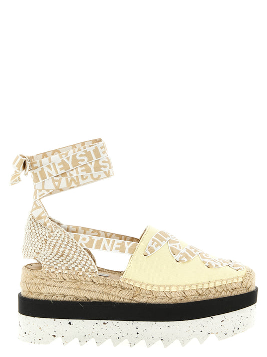 Wedge Sandals by Stella McCartney for women in raffia viscose canvas & faux leather bicolour & yellow features an statuesque Women's Raffia Viscose Canvas & Faux Leather Wedge Sandals silhouette with a refined wedge and elegant .