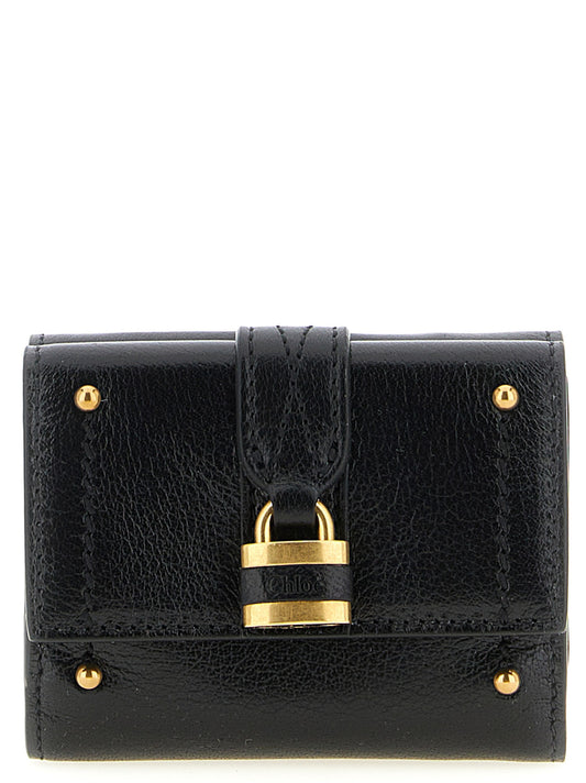 Cardholder Card Case by Chloé for women in brass & buffalo leather black & gold features a distinguished silhouette, showcasing the distinguished design of the Paddington Brass & Buffalo Leather Cardholder Card Case with refined card-organization trifold.