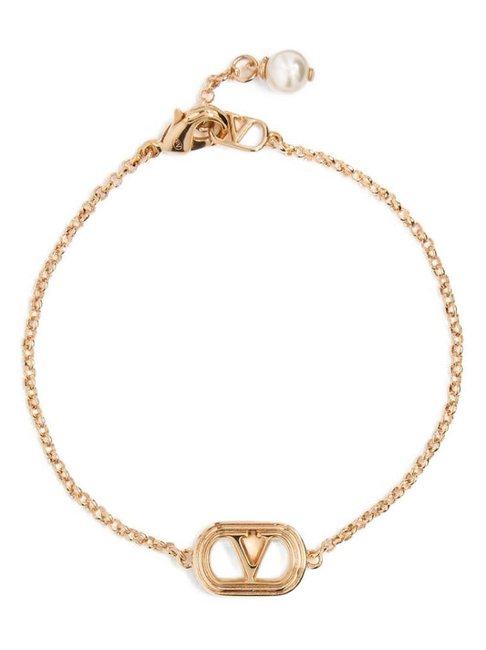 Bracelet by Valentino Garavani for women in cotton gold & signature showcases a luminous , artfully capturing the essence of the luminous V Logo Women's Stainless Steel & Pearls Bracelet collection.