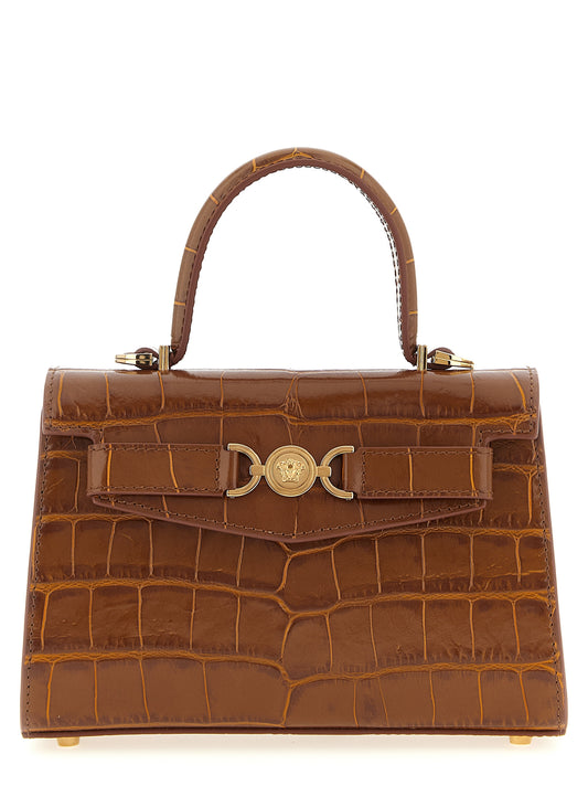 Flap Handbag by Versace for women in calfskin leather brown presents a ornamental silhouette, showcasing a secure flap & magnetic, ample , and versatile shoulder-strap & adjustable-strap for a ornamental finish.