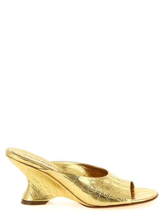 Wedge Mules Sandals by Dries Van Noten for women in bos taurus embossed calfskin leather gold presents a sculptural silhouette, showcasing the Women's Bos Taurus Embossed Calfskin Leather Wedge Mules Sandals design with a sculptural wedge and for a premium look.