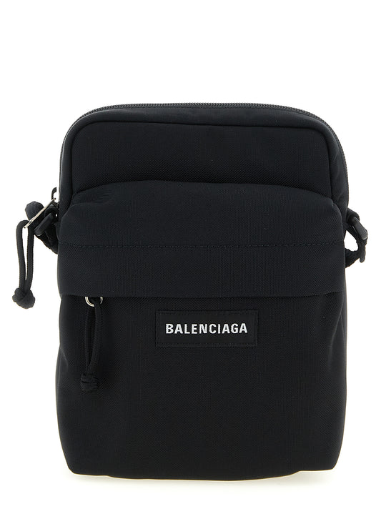 Crossbody Messenger Bag by Balenciaga for men in nylon & polyester black features a distinguished Explorer Nylon & Polyester Crossbody Messenger Bag design with a secure zipper, ample , and versatile crossbody-strap, shoulder-strap & adjustable-strap for a distinguished look.