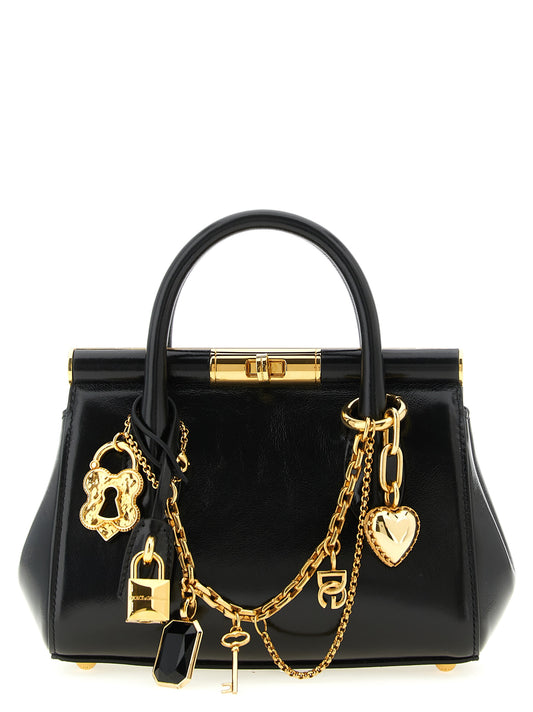 Mini Handbag by Dolce & Gabbana for women in brass zamak & calf leather black presents a ornamental silhouette, showcasing a secure , ample , and versatile shoulder-strap & handle for a ornamental finish.