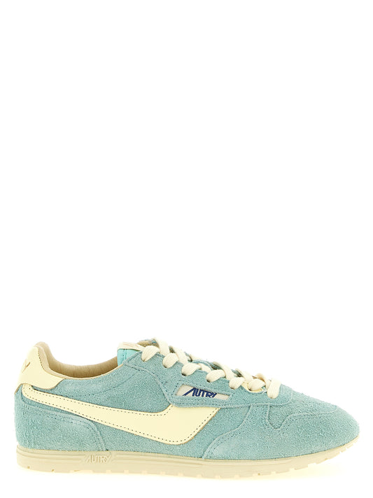 Sneakers by Autry for women in nylon cotton terry & suede cowhide leather light-blue & jacquard features an timeless silhouette from the Women's Low Top Nylon Cotton Terry & Suede Cowhide Leather Sneakers collection, showcasing a signature low-top style with an timeless finish.