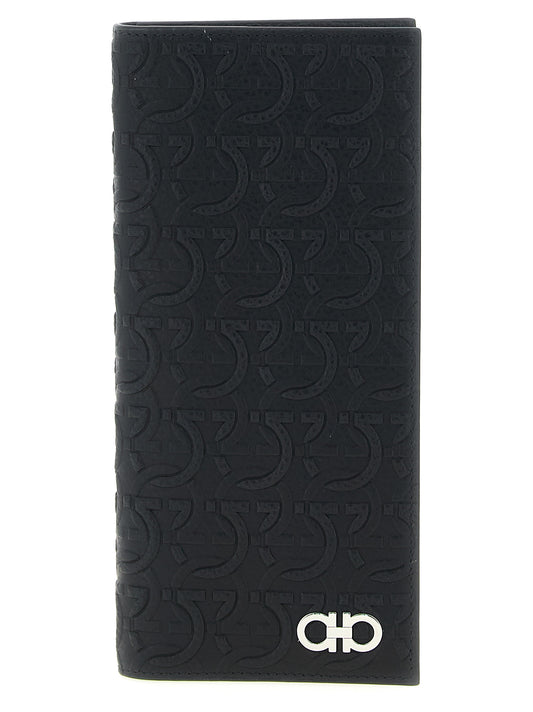 Wallet by Ferragamo for men in calfskin leather black, patterned & signature presents a refined silhouette, artfully capturing the essence of the Gancini Calfskin Leather Wallet design with sophisticated for a refined look.