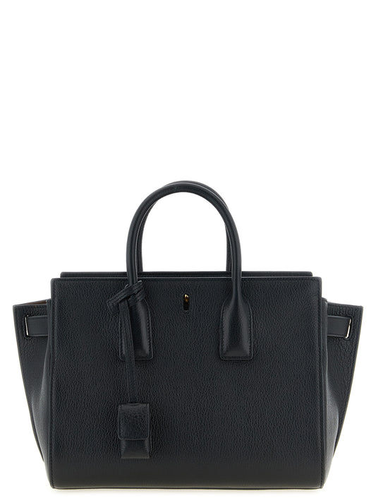 East West Handbag by Saint Laurent for women in viscose goat leather & fur black features a signature silhouette, showcasing a secure and signature with versatile adjustable-strap & handle for a sophisticated look.