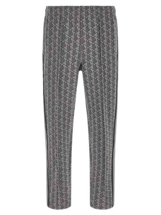 Joggers by Lacoste for men in polyamide polyester & cotton gray, jacquard & monogram features a polished silhouette with a polished straight-leg, reaching a polished long and finished with a polished .