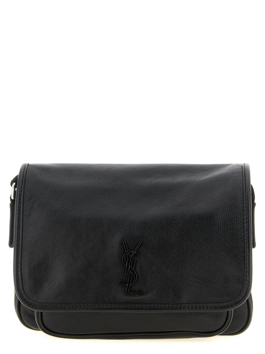 Small Crossbody Messenger Bag by Saint Laurent for men in calfskin leather black features an fashionable Cassandre Essence Niki Calfskin Leather Small Crossbody Messenger Bag design with a fashionable flap & magnetic, ample , and versatile crossbody-strap, shoulder-strap & adjustable-strap for a sophisticated finish.
