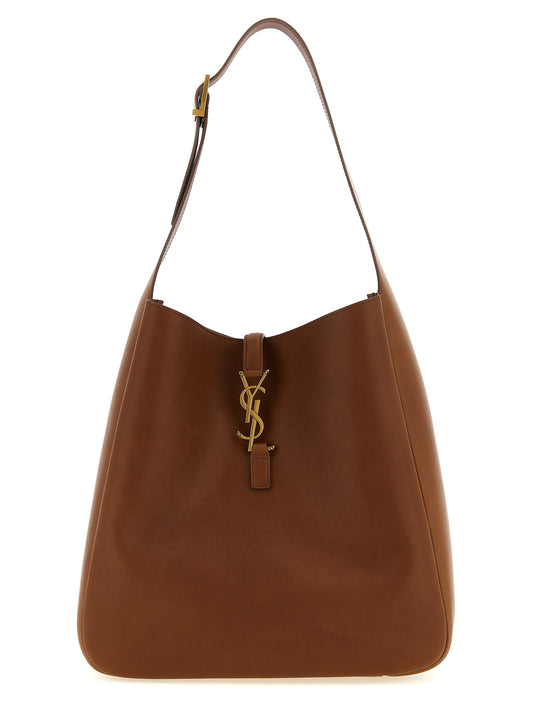 Large Shoulder Clutch Bag by Saint Laurent for women in suede calfskin leather brown features a effortless chic silhouette with a secure , ample , and versatile shoulder-strap, adjustable-strap & handle for a effortless chic finish.