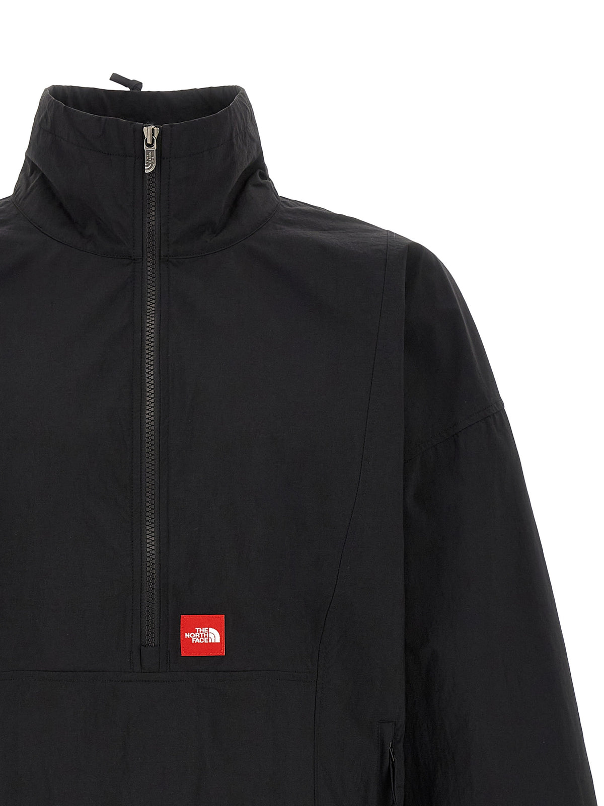 Windbreaker Jacket by The North Face for men in nylon black & red features an perennial silhouette with a refined high-neck neckline and perennial pockets & windproof for a sophisticated weather-resistant look.