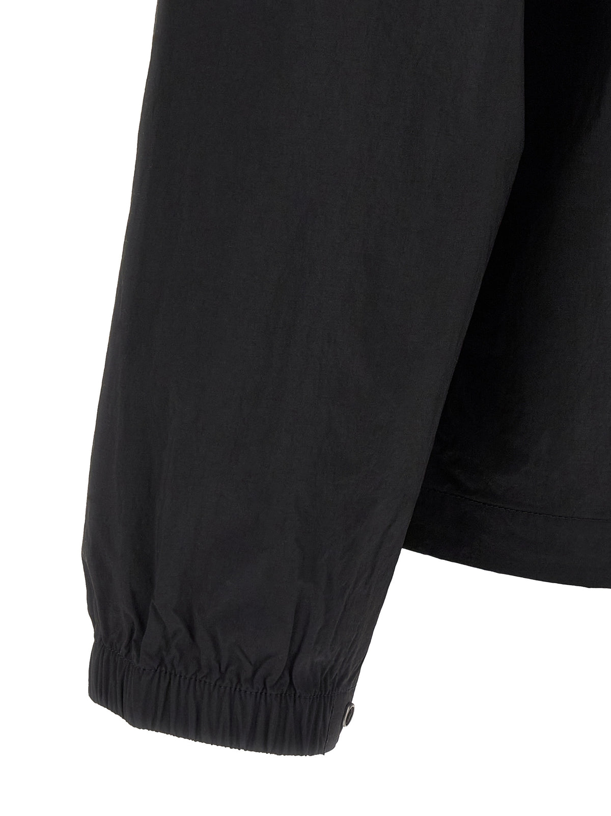Windbreaker Jacket by The North Face for men in nylon black & red showcases a urban chic silhouette, detailed with a urban chic and functional pockets & windproof for a polished finish.