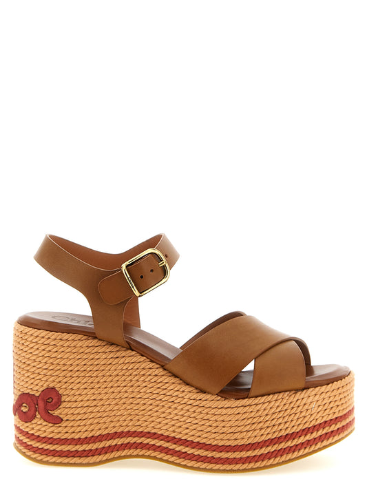 Wedge Ankle Strap Sandals by Chloé for women in calfskin leather & tu brown & signature features an effortlessly chic silhouette from the Women's Calfskin Leather & TU Wedge Ankle Strap Sandals collection, showcasing a effortlessly chic wedge and elegant .
