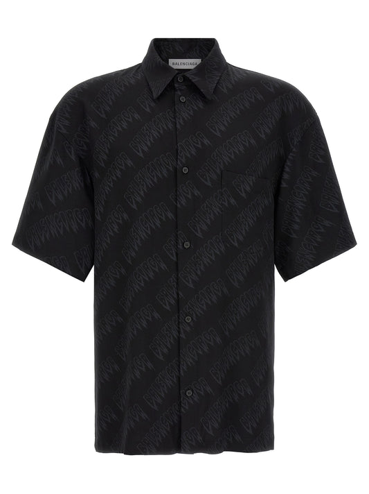 Blouse by Balenciaga for men in viscose black & print presents a discerning silhouette, showcasing a sophisticated and short-sleeve for a truly discerning finish.
