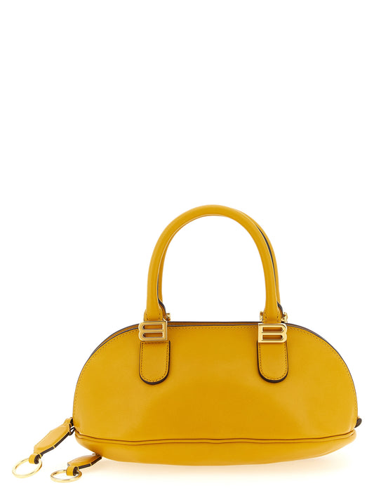 Mini Bowling Handbag by Balenciaga for women in calfskin leather bicolour & yellow features an refined silhouette, showcasing a secure zipper, ample , and versatile shoulder-strap, adjustable-strap & handle for a sophisticated refined aesthetic.