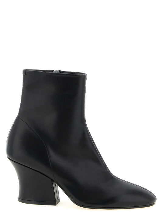 Ankle Boots by Jil Sander for women in calfskin leather black showcases a ergonomic silhouette from the Women's Calfskin Leather Ankle Boots collection, featuring a ergonomic and a ergonomic almond toe style.