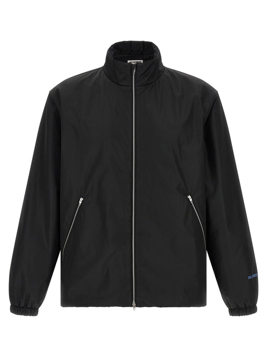 Overcoat by Jil Sander for men in polyester black showcases a architectural silhouette, artfully detailed with a distinctive high-neck neckline and functional pockets for a architectural finish.