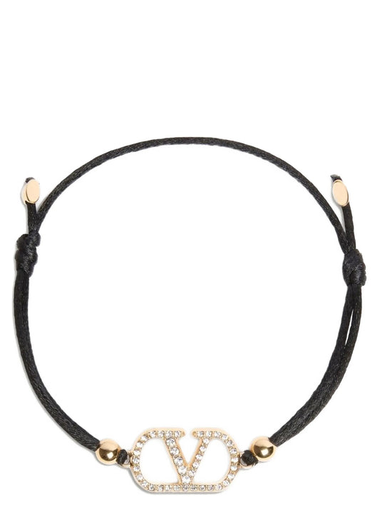 Bracelet by Valentino Garavani for women in nubuck & suede lamb leather black showcases a enchanting silhouette, artfully highlighting the cord bracelet design and signature V Logo Women's Cord Polyester Leather & Rhinestone Bracelet aesthetic in this enchanting piece.
