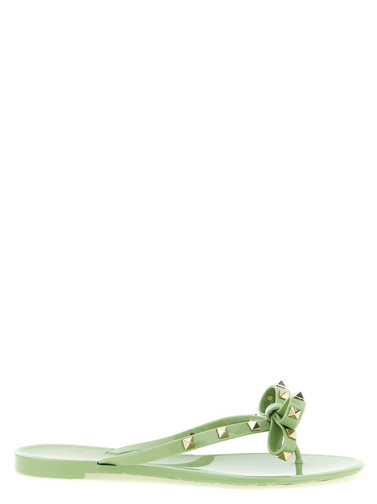 Sliders Sandals Flat Shoes by Valentino Garavani for women in pvc bicolour & green presents a impeccable silhouette as Rockstud Women's PVC Sliders Sandals Flat Shoes, artfully designed with a and a impeccable for a refined, upscale finish.