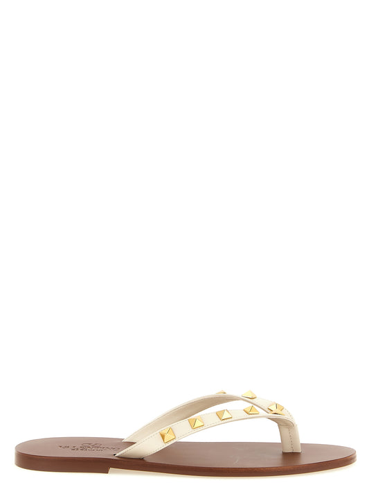 Sliders Sandals Flat Shoes by Valentino Garavani for women in calfskin leather white & signature presents a impeccable silhouette as Rockstud Women's Calfskin Leather Sliders Sandals Flat Shoes, artfully designed with a and a impeccable for a refined, upscale finish.