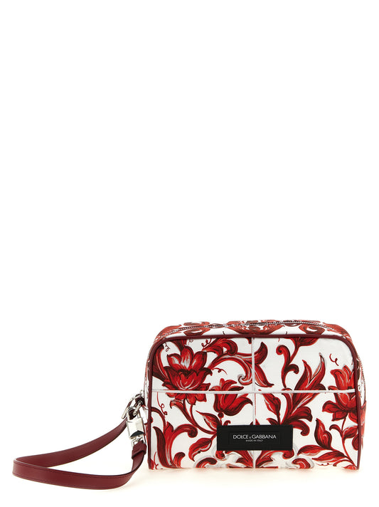 This Handbag by Dolce & Gabbana for unisex in calfskin leather & cotton and multicolor, palladium, red & print presents a sculptural silhouette featuring a secure , ample , and versatile handle for a sculptural finish.
