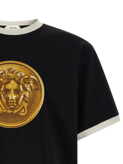 T-Shirt by Versace for men in cotton black & print showcases a unassuming silhouette, artfully detailed with a refined crew neckline and unassuming for a sophisticated, contemporary look.