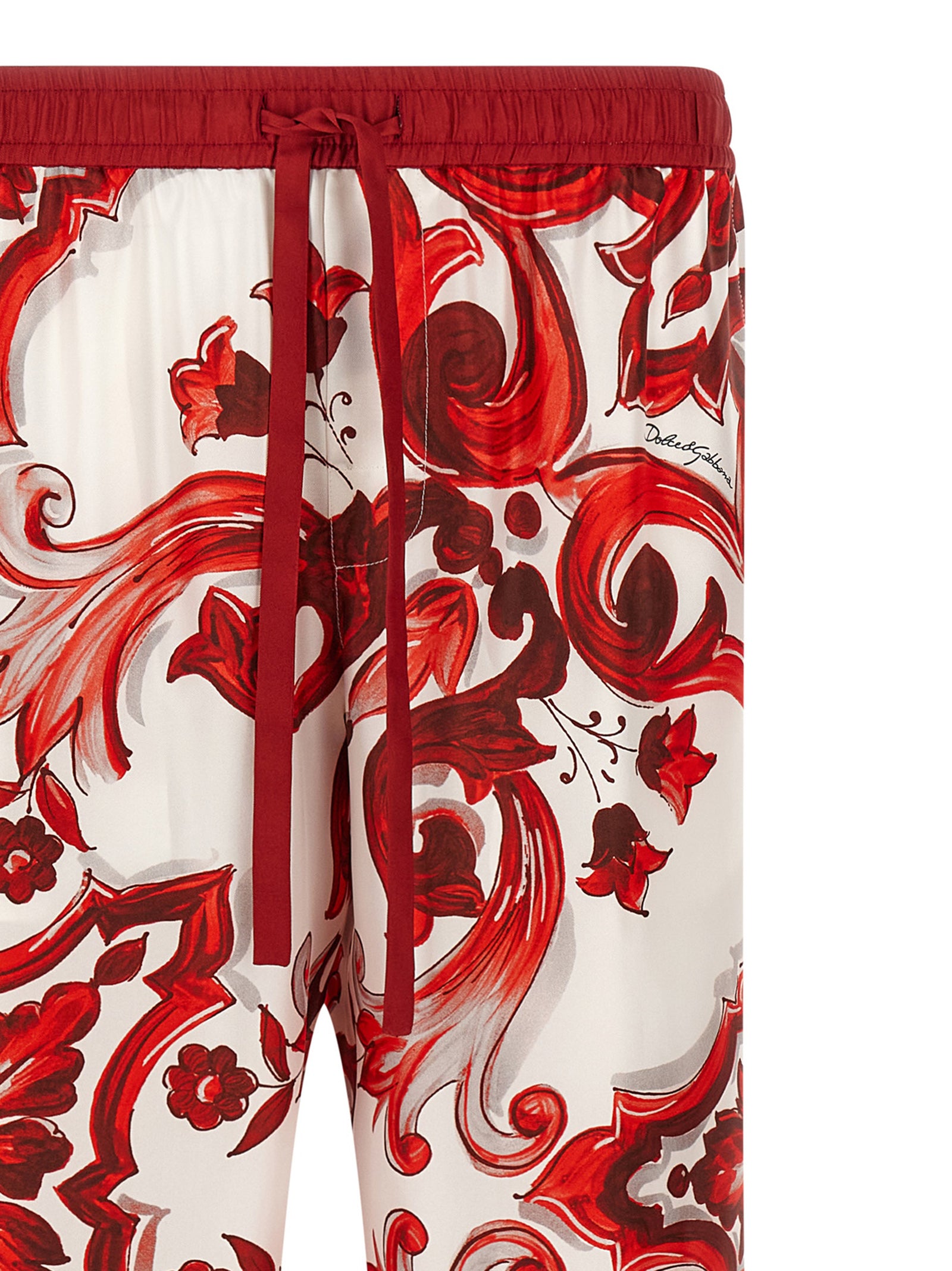 Casual Pants by Dolce & Gabbana for men in silk twill multicolor, red, signature & print features a polished silhouette with a polished straight-leg & wide, reaching a polished long and finished with a polished .