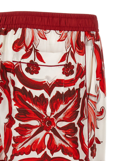 Casual Pants by Dolce & Gabbana for men in silk twill multicolor, red, signature & print features an sartorial straight-leg & wide and long with a cut for a sartorial finish.