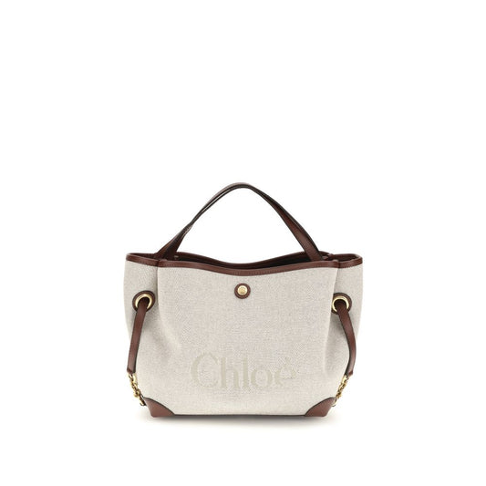 Handbag by Chloé for women in stretch cotton modal canvas beige & jacquard features a ornamental silhouette, showcasing a secure magnetic & button, ample , and ornamental shoulder-strap, handle & adjustable-strap for a sophisticated look.