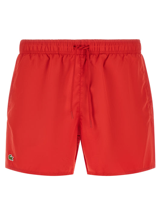 Short Trousers by Lacoste for men in polyester mesh multicolor & red showcases a effortlessly chic silhouette, artfully tailored with a effortlessly chic , a short cut, and a refined for a effortlessly chic finish.