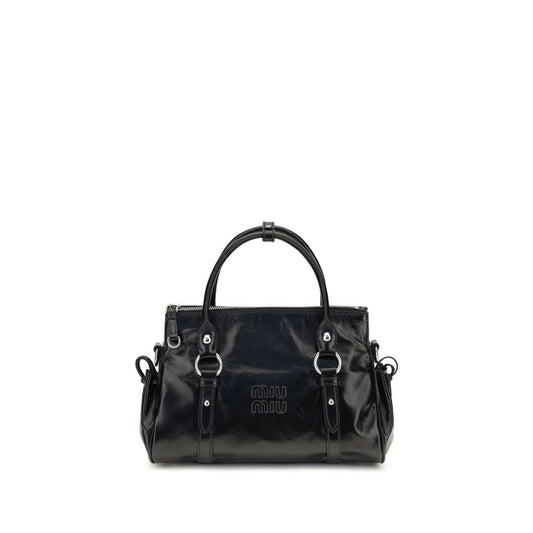 Handbag by Miu Miu for women in bos taurus calf leather & plexiglass black features a signature silhouette, showcasing a secure zipper and signature with versatile shoulder-strap, adjustable-strap & handle for a sophisticated look.