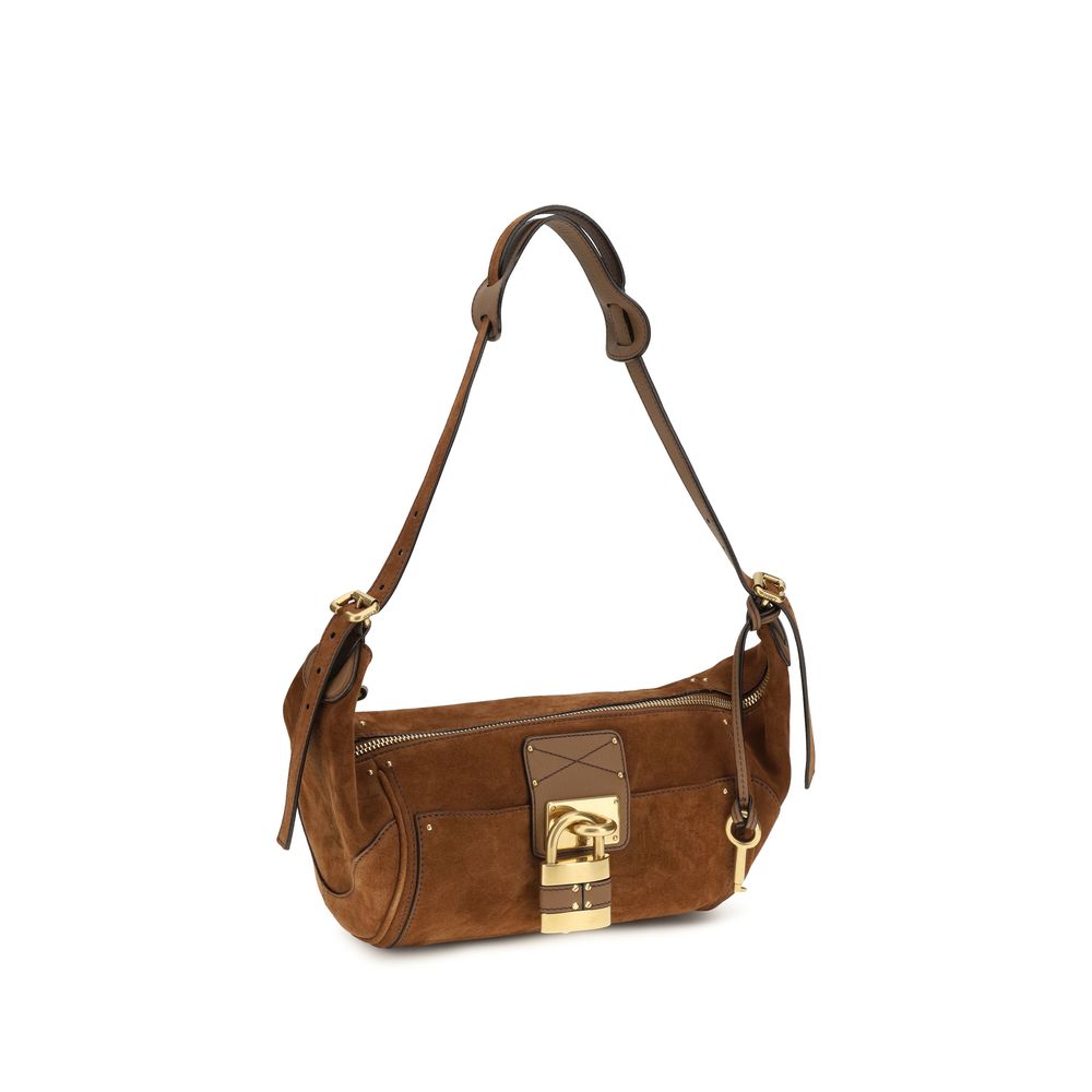 Micro Shoulder Bag by Chloé for women in bos taurus calf nappa leather brown, gold & signature features an effortlessly chic silhouette with a secure zipper & buckle, ample external-pockets, and versatile shoulder-strap & adjustable-strap for effortlessly chic everyday luxury.