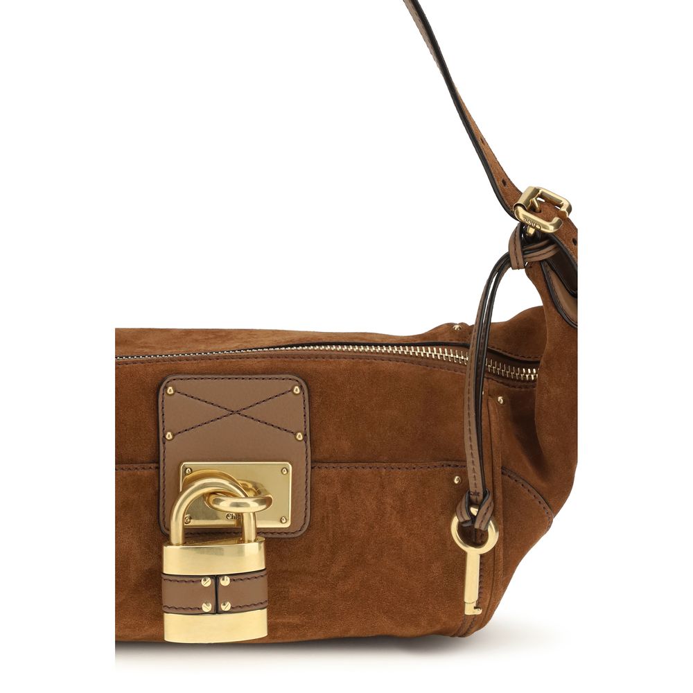 Micro Shoulder Bag by Chloé for women in bos taurus calf nappa leather brown, gold & signature features a stately silhouette, showcasing a secure zipper & buckle, ample external-pockets, and stately shoulder-strap & adjustable-strap for a stately finish.