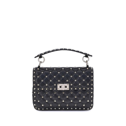 This Small Quilted Crossbody Flap Handbag by Valentino Garavani for women in nappa leather and black presents a sculptural silhouette featuring a secure flap, ample , and versatile crossbody-strap, adjustable-strap & handle for a sculptural finish.