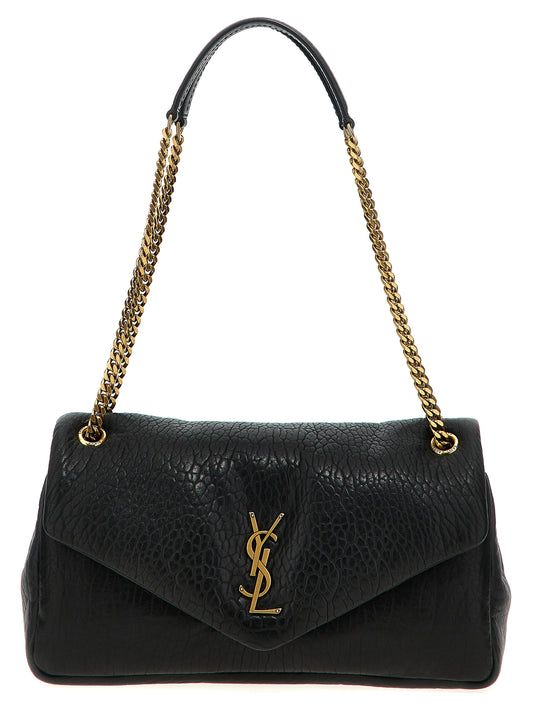 Quilted Shoulder Flap Bag by Saint Laurent for women in leather & metal black features a effortless chic silhouette with a secure flap & magnetic, ample , and versatile shoulder-strap for a effortless chic finish.