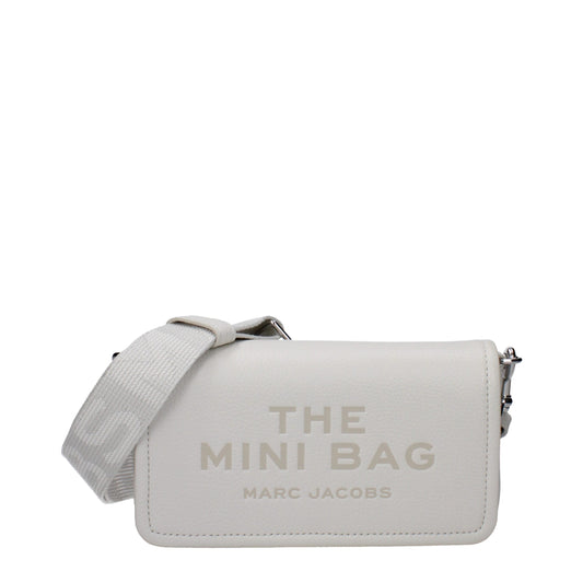 Mini Crossbody Handbag by Marc Jacobs for women in leather & cotton white features a transformative elegance silhouette, showcasing a secure magnetic, organized built-in-compartments & cardholder, and versatile crossbody-strap, shoulder-strap & adjustable-strap for a transformative elegance look.