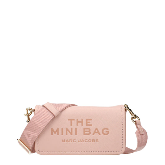 Crossbody Handbag by Marc Jacobs for women in leather pink features a transformative sophistication silhouette, showcasing a secure , ample , and versatile crossbody-strap & adjustable-strap for a transformative sophistication look.