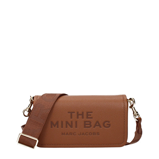Crossbody Handbag by Marc Jacobs for women in leather brown features a versatile chic silhouette, meticulously detailed with a secure , ample , and versatile crossbody-strap & adjustable-strap.