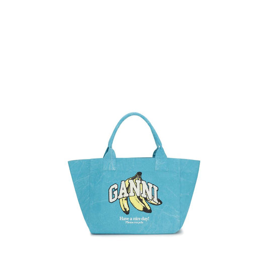Medium Shoulder Tote Bag by Ganni for women in cotton blue & print features a statuesque silhouette, showcasing a secure zipper and statuesque single-compartment with versatile shoulder-strap & handle for a statuesque finish.