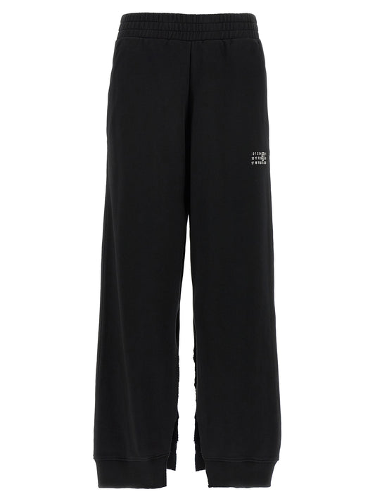 Joggers by MM6 Maison Margiela for women in cotton black, white, signature & print features a refined silhouette with a refined wide, defined by a high rise and a refined long for a refined finish.