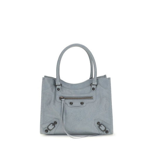 Mni Tote Handbag by Balenciaga for women in brass zamak & calf leather blue presents a ornamental silhouette, showcasing a secure zipper & magnetic, ample , and versatile handle & adjustable-strap for a ornamental finish.
