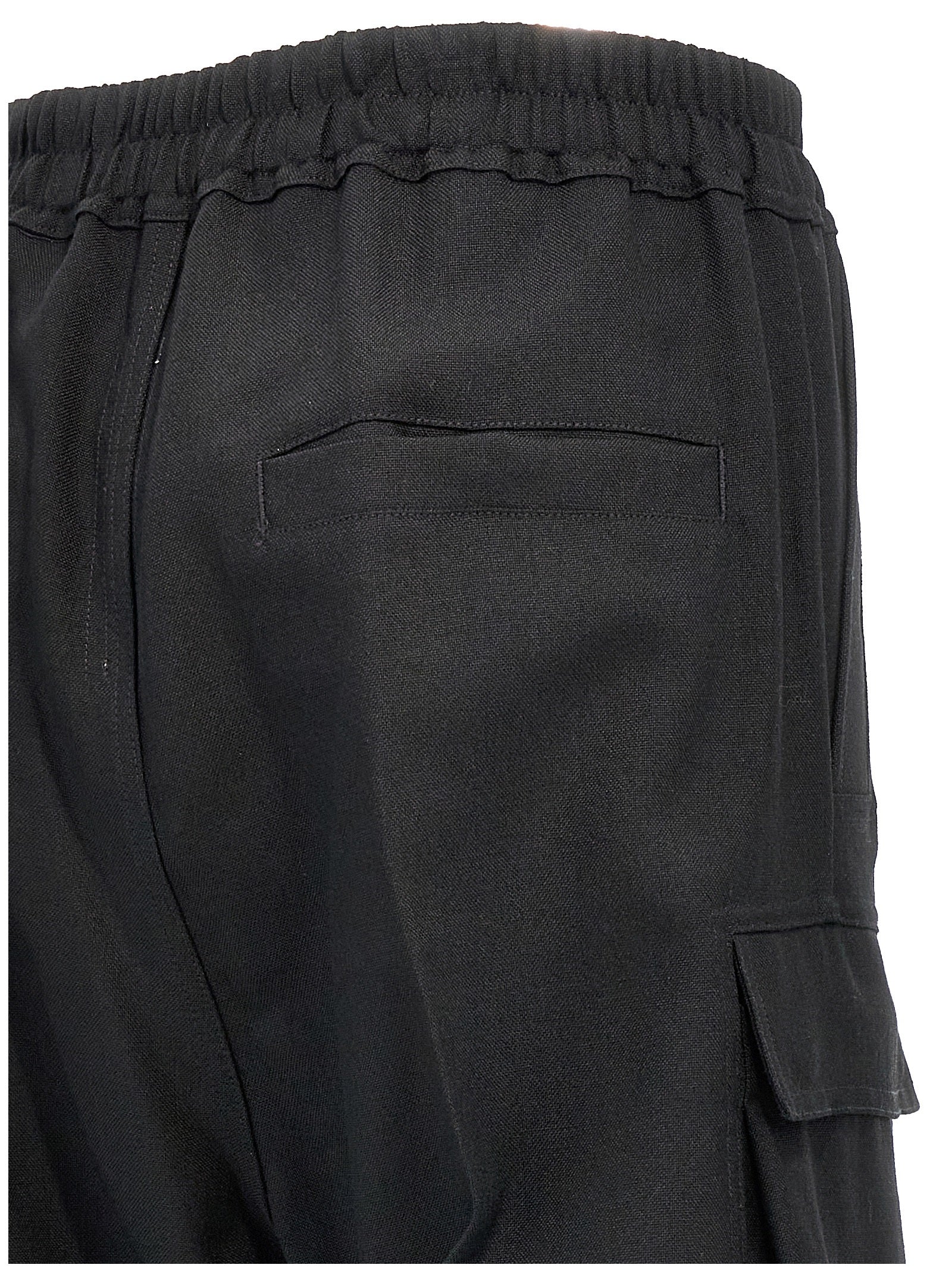 Cargo Pants by Rick Owens for women in wool black features an smart casual flared, relaxed-fit & wide and long, expertly tailored with a and smart casual utilitarian details for a sophisticated look.