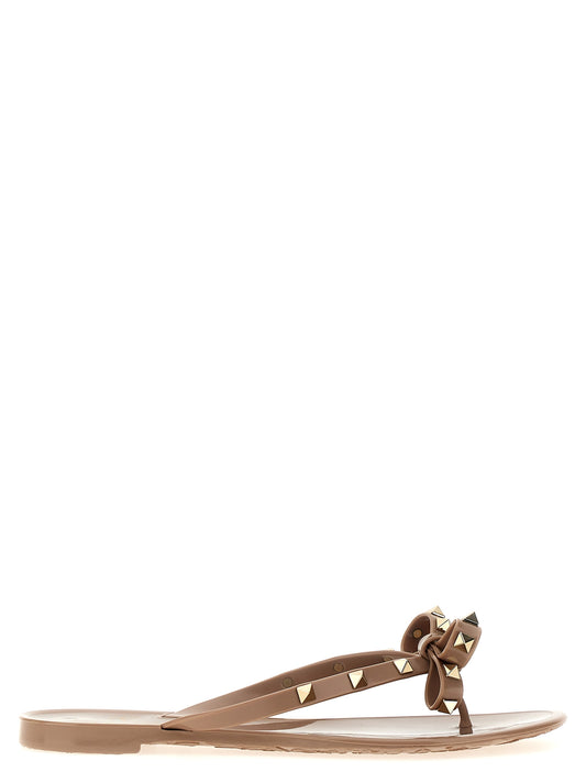 Sliders Sandals Flat Shoes by Valentino Garavani for women in pvc multicolor, pink & patterned features an captivating silhouette, showcasing the captivating style of the City Rockstud Women's PVC Sliders Sandals Flat Shoes with its distinct and refined .