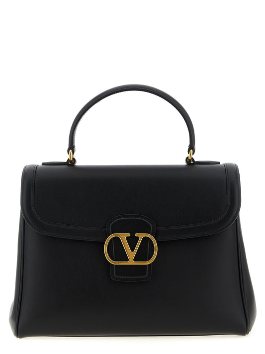 Flap Handbag by Valentino Garavani for women in calfskin leather black & signature presents a ornamental silhouette, showcasing a secure flap & magnetic, ample , and versatile shoulder-strap, adjustable-strap & handle for a ornamental finish.
