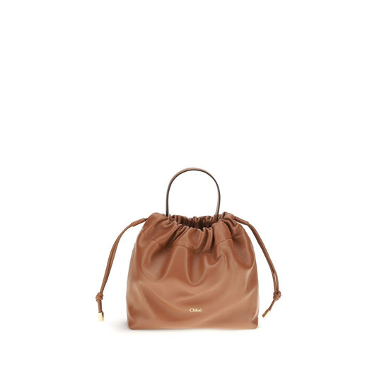 Shoulder Drawstring Bag by Chloé for women in lamb leather brown features a stately silhouette, showcasing a secure drawstring, ample , and stately shoulder-strap & handle for a stately finish.