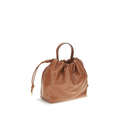 Shoulder Drawstring Bag by Chloé for women in lamb leather brown showcases a statuesque silhouette, artfully detailed with a secure drawstring, organized , and versatile shoulder-strap & handle for a statuesque look.
