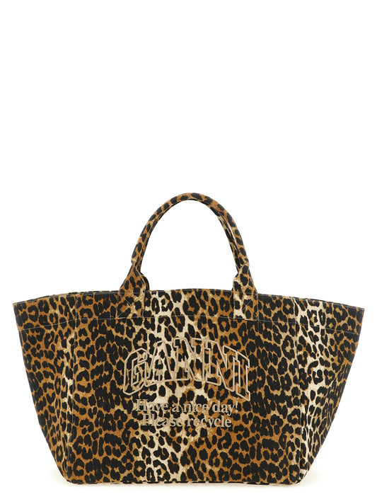 Tote Bag by Ganni for women in cotton canvas black, brown, leopard-print & print showcases a statuesque Cotton Canvas Tote Bag design, featuring a secure zipper, ample , and versatile handle for a statuesque finish.