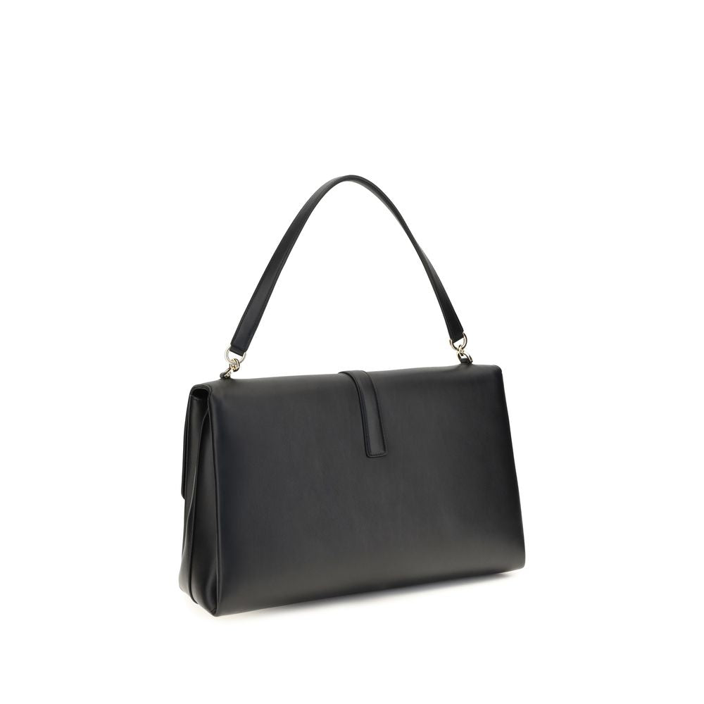 Large Shoulder Flap Clutch Bag by Ferragamo for women in bos taurus calf leather black features an effortlessly chic silhouette with a secure flap, ample , and versatile shoulder-strap & handle for effortlessly chic everyday luxury.