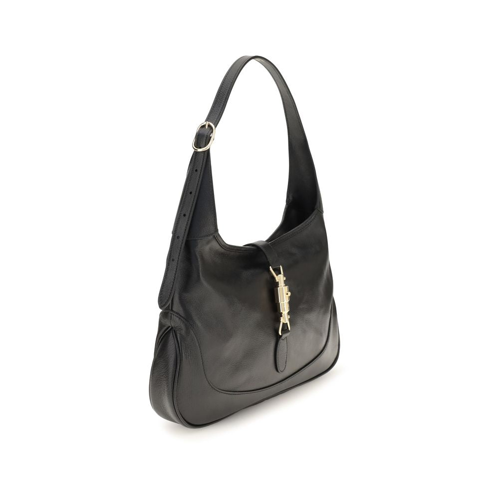Medium Shoulder Bag by Gucci for women in bos taurus calf leather black, gold, natural & signature features a statuesque silhouette, showcasing a secure zipper and statuesque with versatile shoulder-strap & adjustable-strap for a statuesque finish.